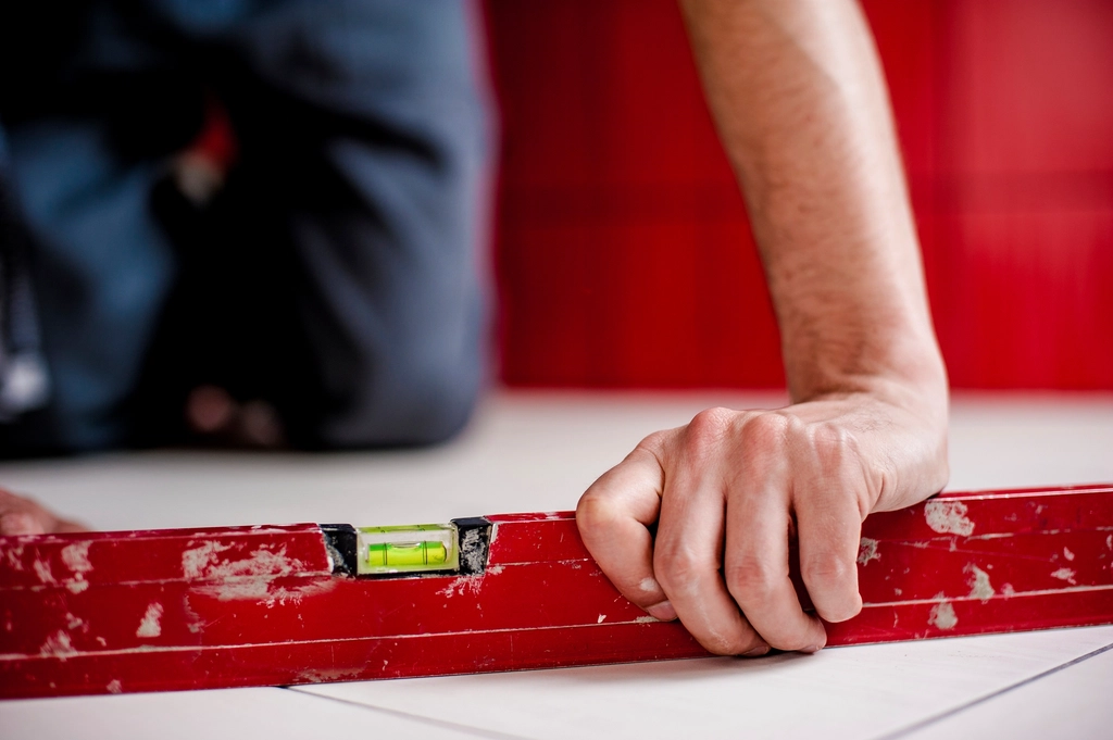 Builder reviewing plans on site