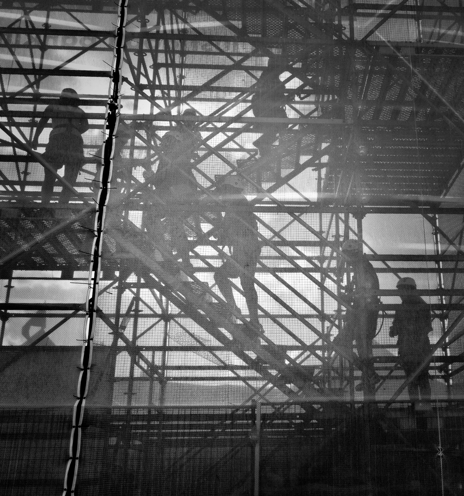 Construction workers on scaffolding
